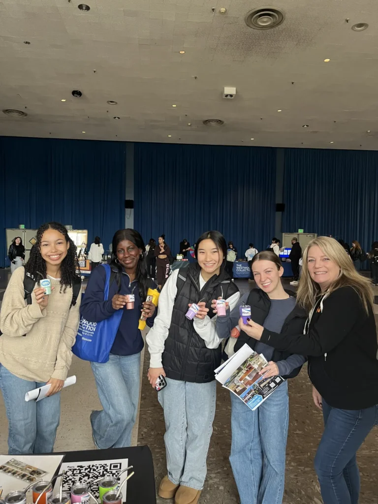 Students with giveaways and details about The Hive apartments - Student housing Los Angeles