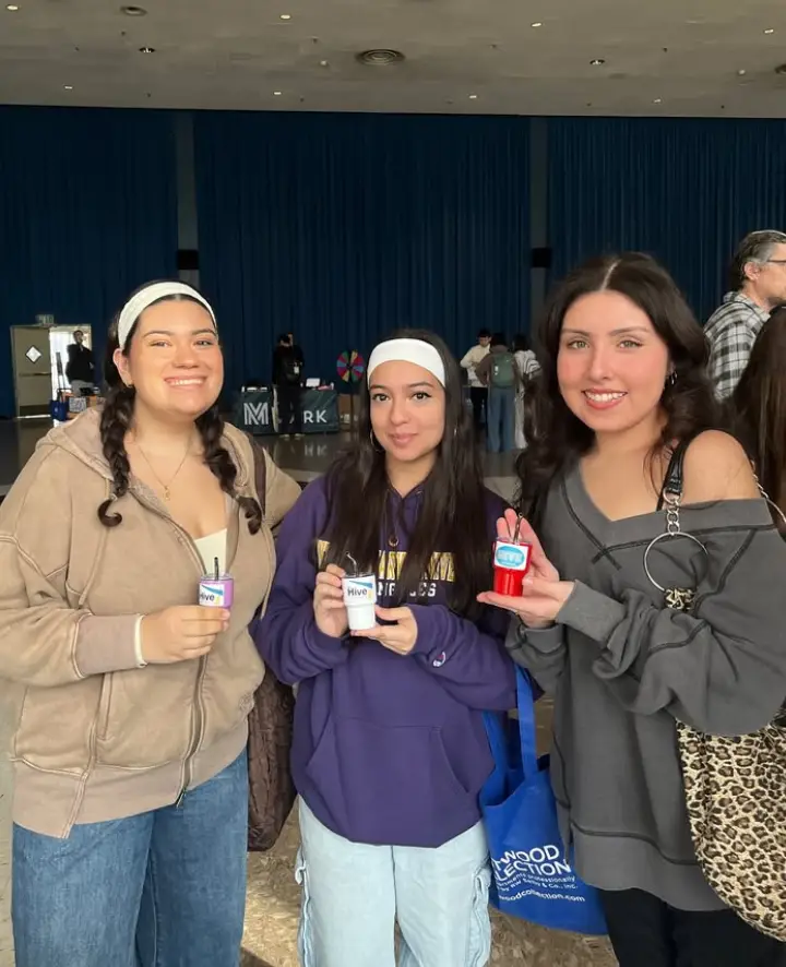 Students picking up freebies and info at The Hive Glenrock stand - UCLA Housing Apartments