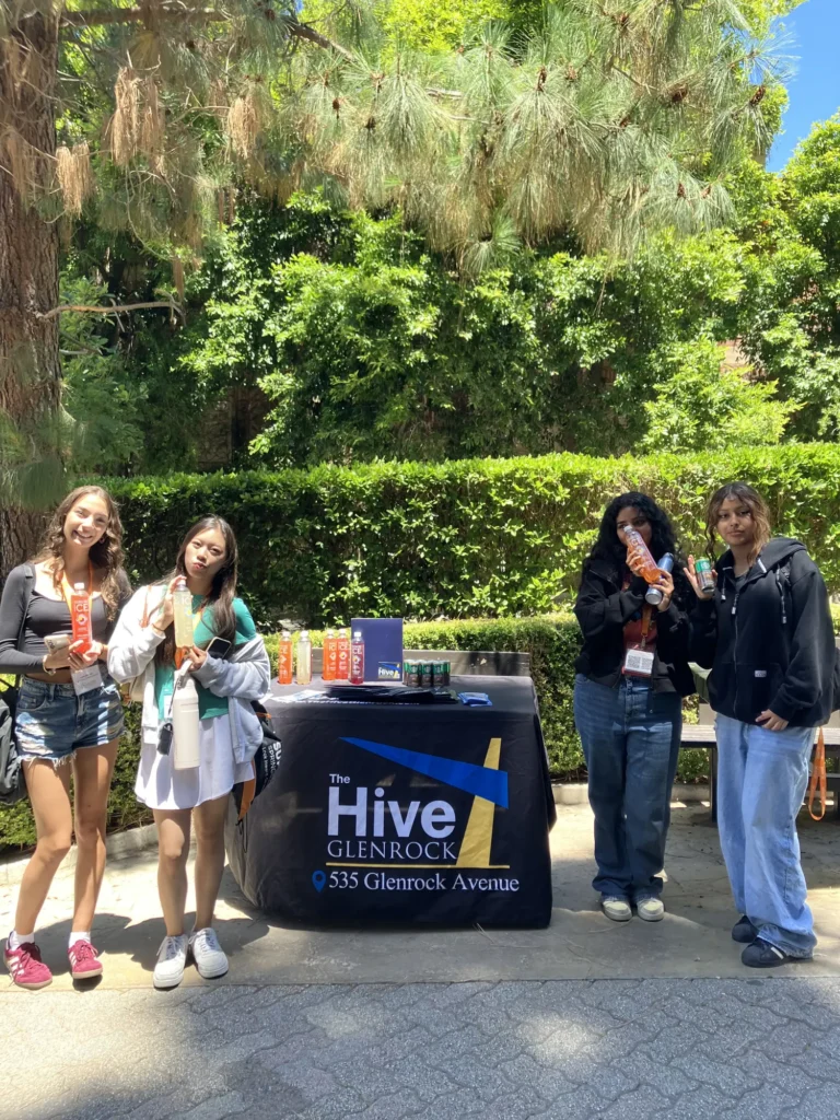 Students visiting The Hive Glenrock information stand at an event - Housing for UCLA Students