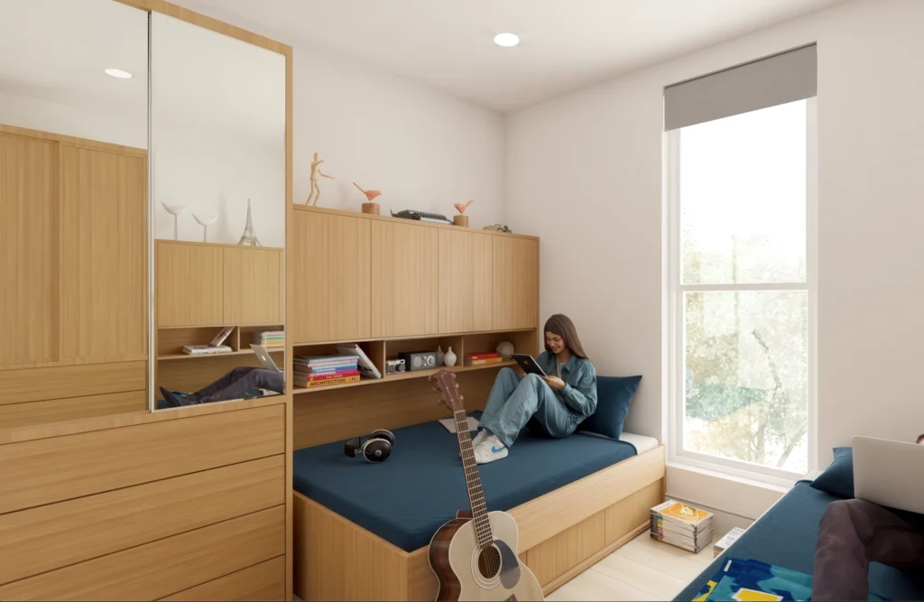 Student reading in her shared bedroom at UCLA Glenrock Apartments - Apartments near UCLA Campus